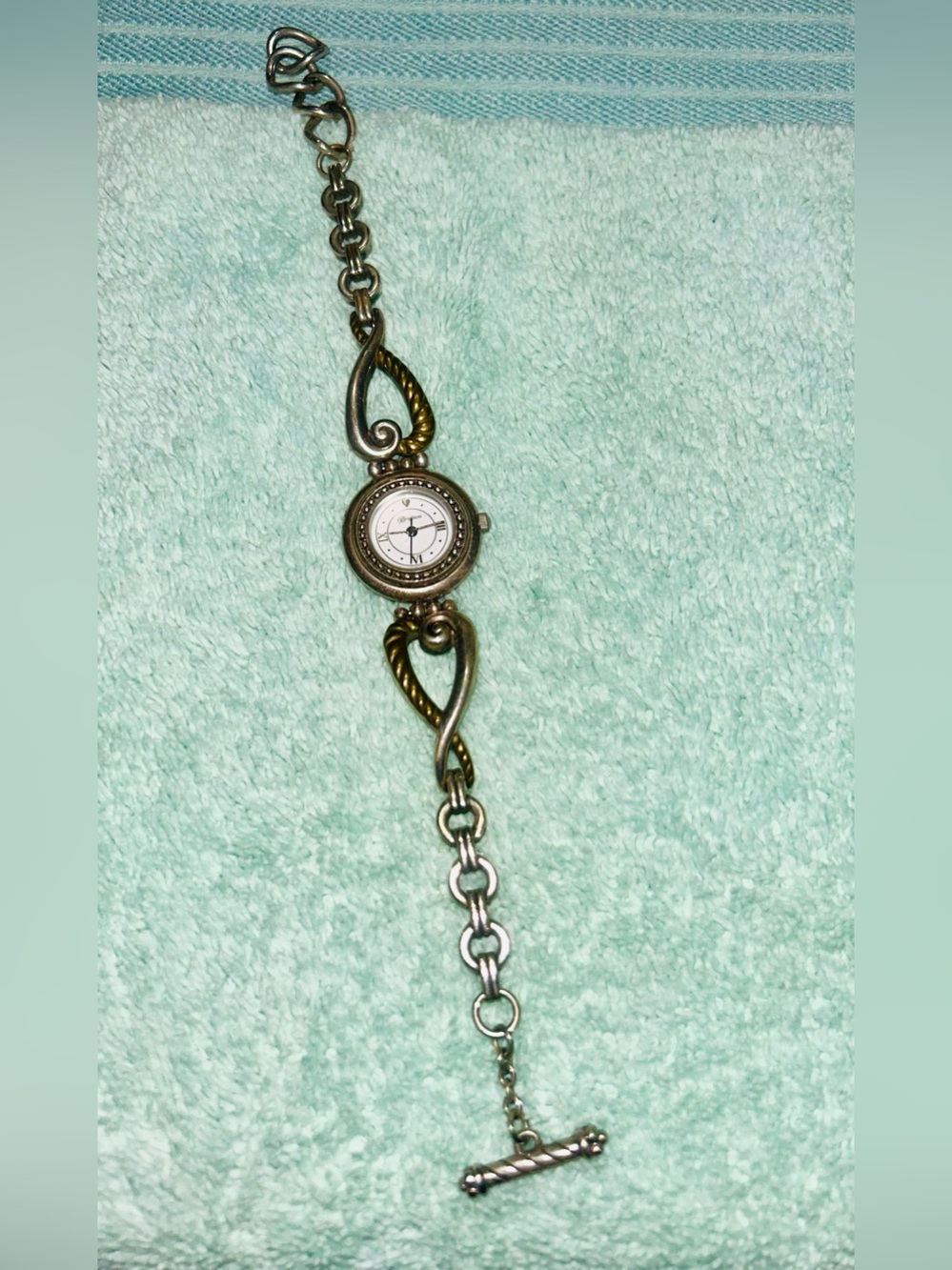 two-tone Brighton Charleston Watch featuring a round white face. RETIRED